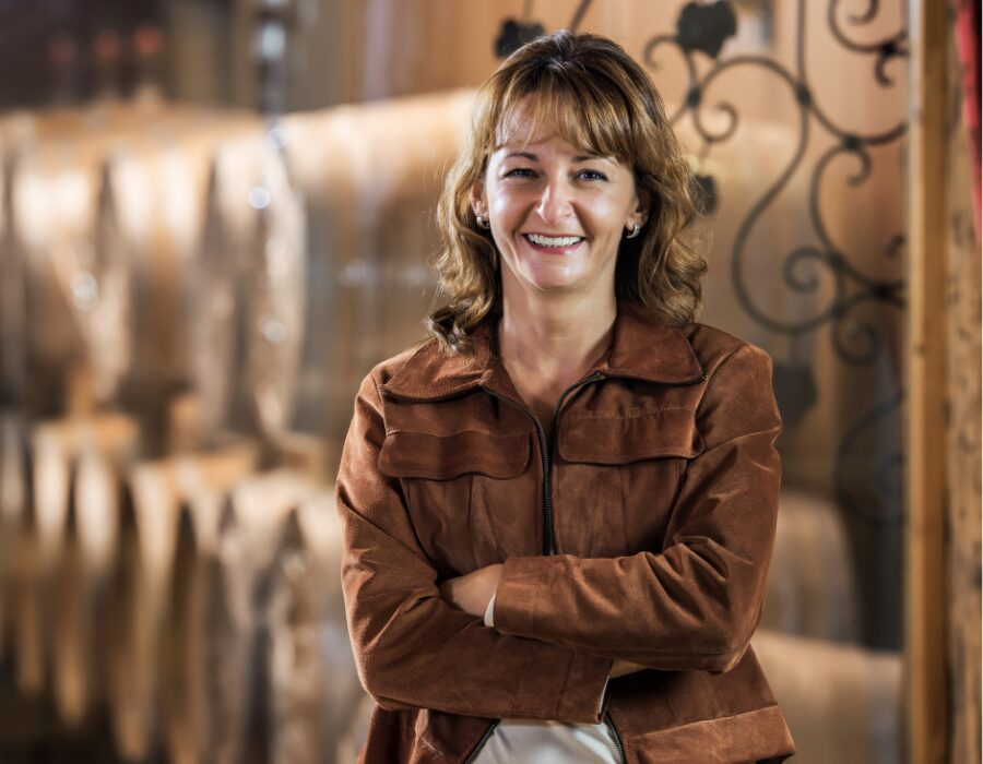 Winery owner smiling in her tasting room