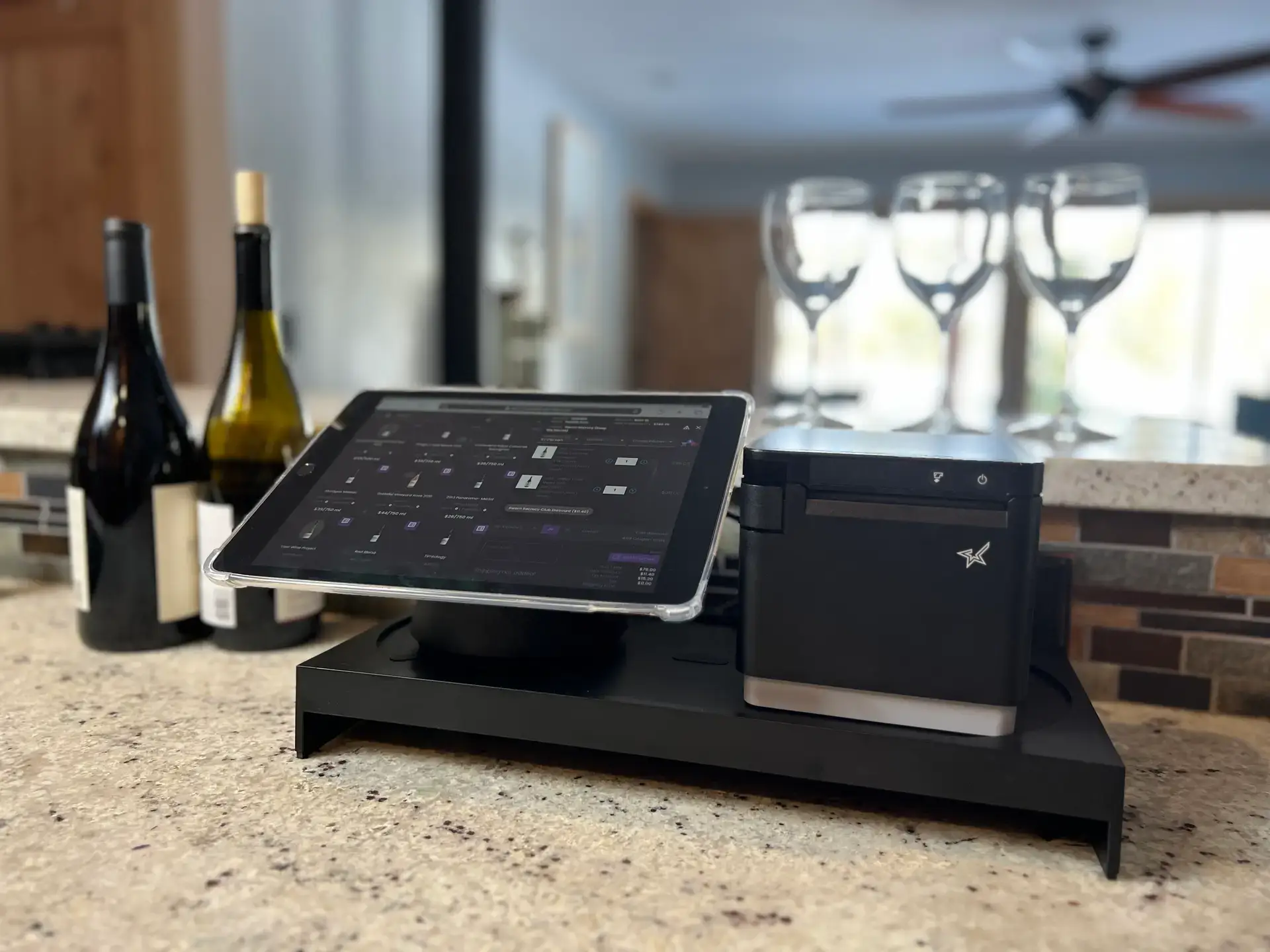 Bottle360 POS hardware with tablet, receipt printer, and wine bottles