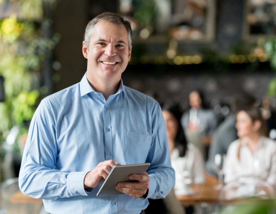 Manager reviewing winery reports on a tablet